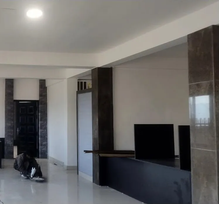 The finished interior with tiled feature pillars and a level floor