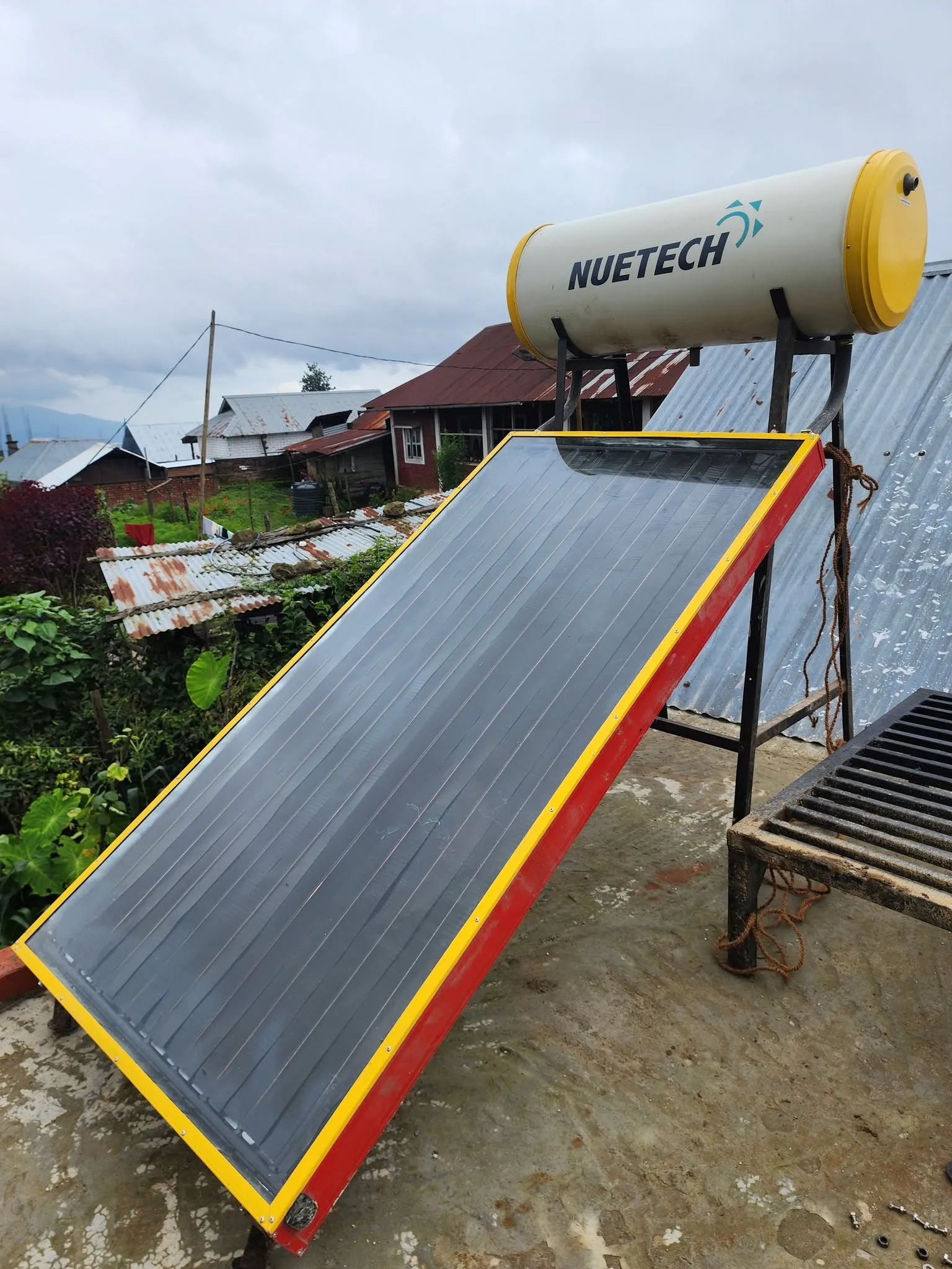 Solar water heater installed on a CGI roof by Ningshen Painting Work, Ukhrul, Manipur
